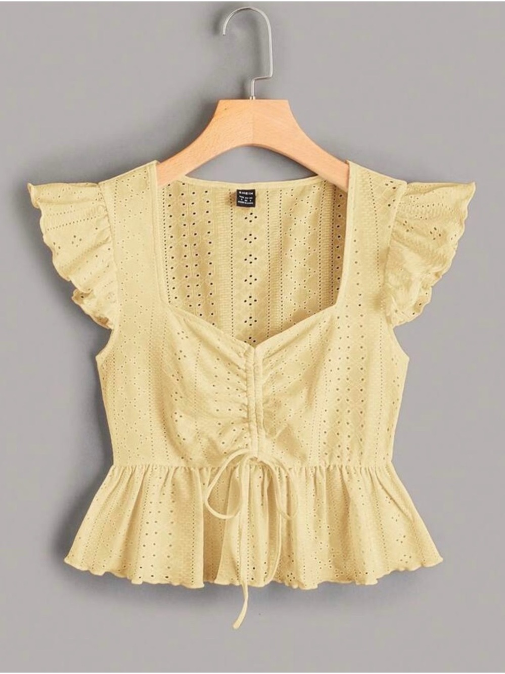 Drawstring Eyelet Peplum Blouse in Pale Yellow